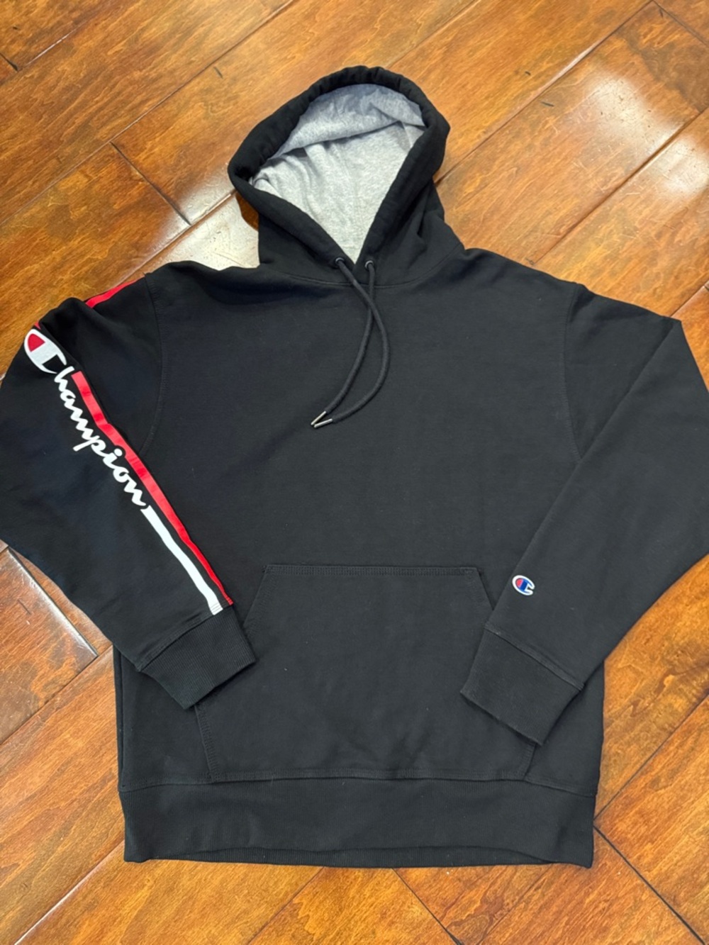 Champion Black Hoodie with Red & White Sleeve Stripe. Great condition.